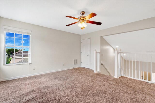 empty room featuring carpet flooring and ceiling fan