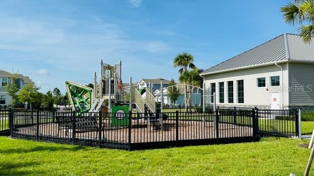 view of jungle gym featuring a yard