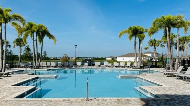 view of swimming pool with a patio