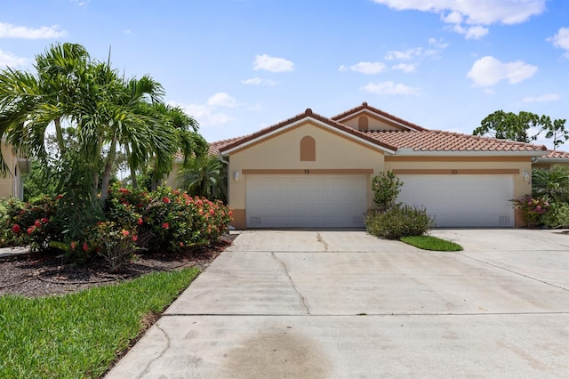 mediterranean / spanish-style home featuring a garage