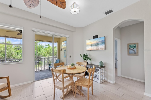 dining space with plenty of natural light, ceiling fan, and light tile patterned flooring