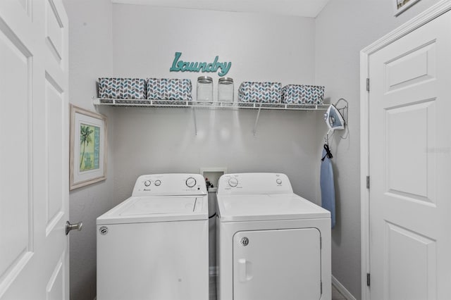 laundry area with independent washer and dryer