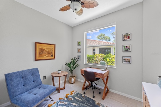 interior space with light tile patterned flooring and ceiling fan