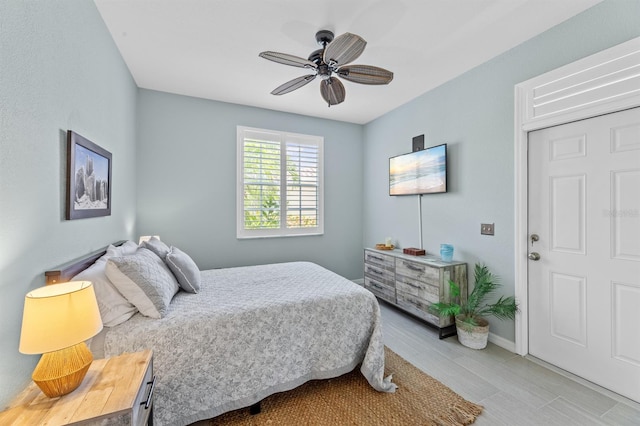 tiled bedroom with ceiling fan