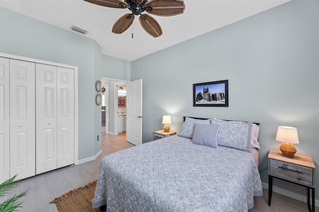 bedroom featuring light wood-type flooring, a closet, and ceiling fan