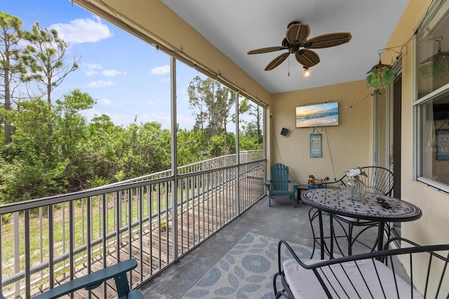 exterior space with ceiling fan