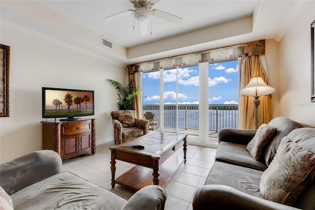 tiled living room featuring ceiling fan