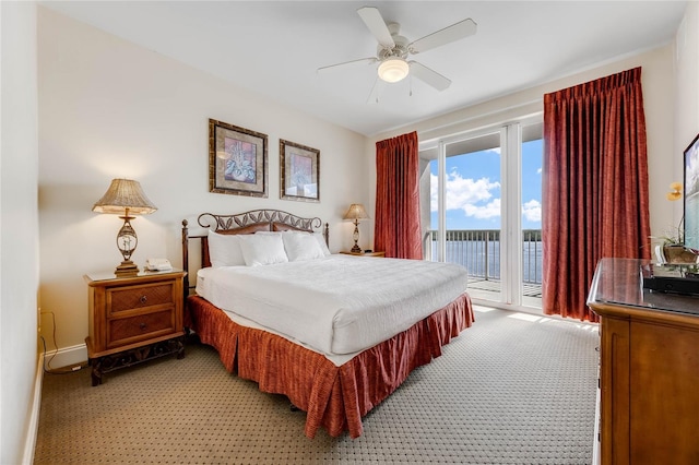 bedroom featuring access to outside, ceiling fan, and carpet flooring