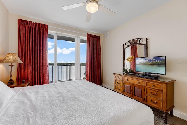 carpeted bedroom featuring access to exterior and ceiling fan