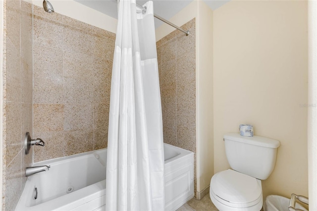 bathroom with toilet and shower / bath combo