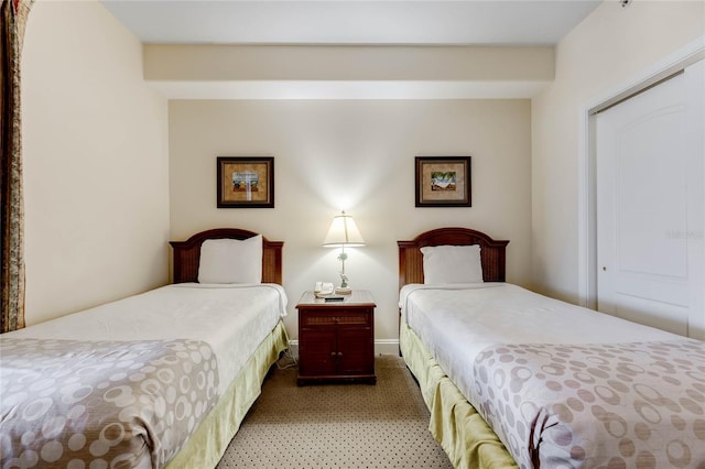 carpeted bedroom featuring a closet