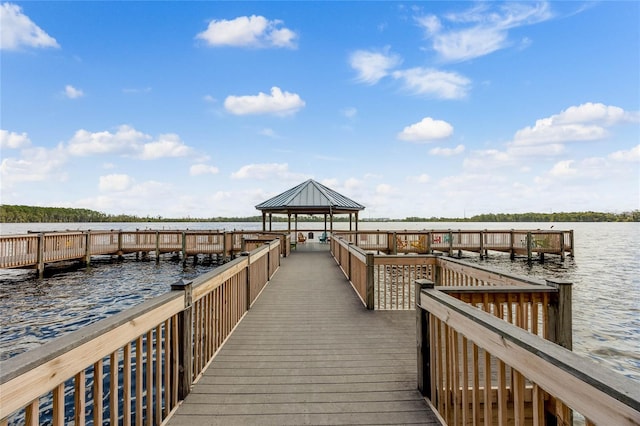 view of dock featuring a gazebo and a water view