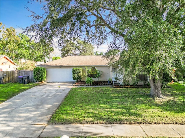 view of front of house featuring a garage and a front yard