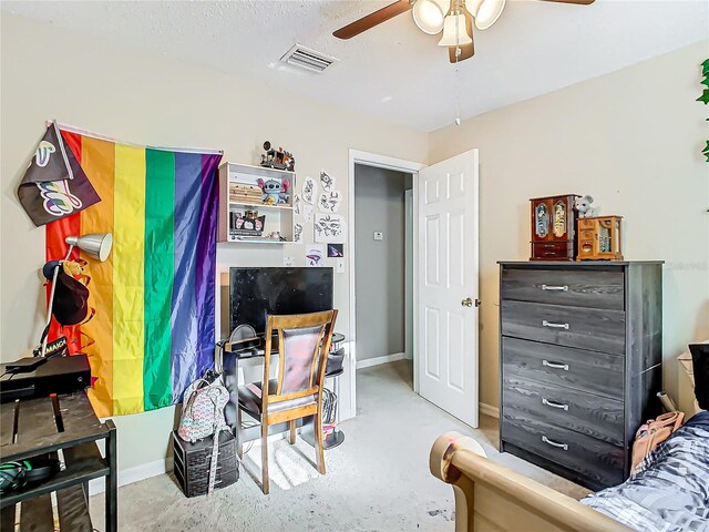 bedroom featuring a textured ceiling and ceiling fan