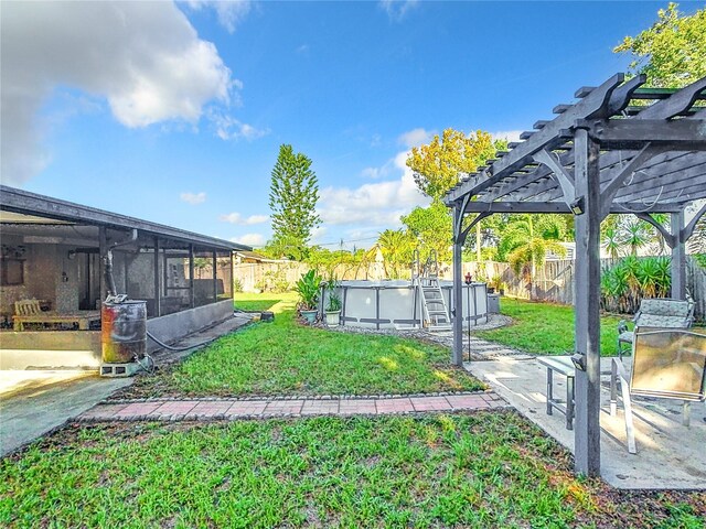 view of yard with a fenced in pool, a pergola, and a patio