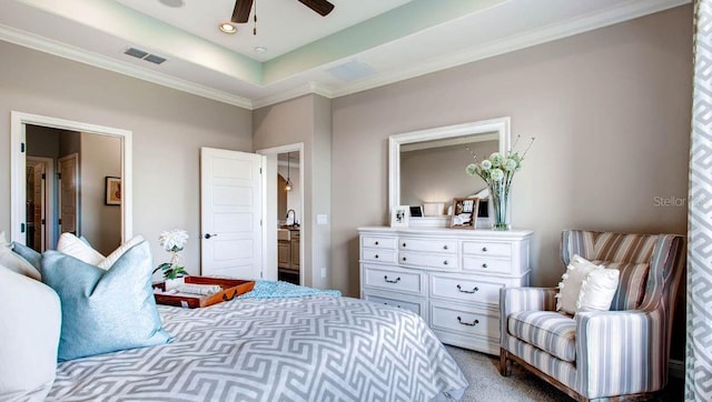 bedroom featuring ceiling fan, a raised ceiling, and carpet floors