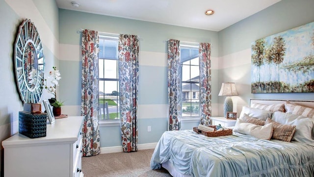 bedroom with light colored carpet