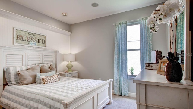 bedroom with light colored carpet