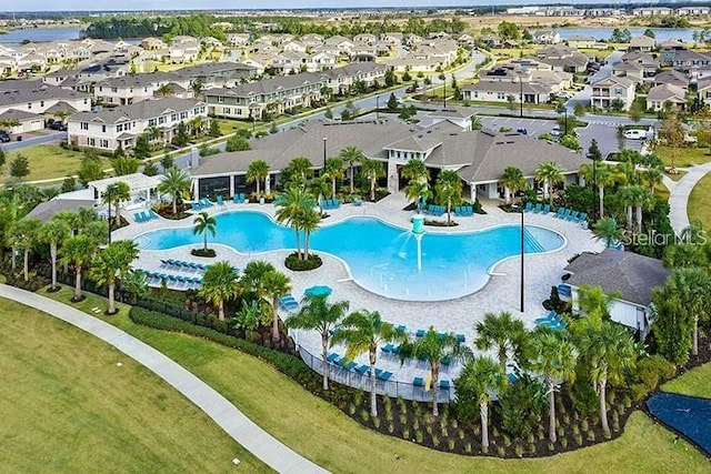 view of swimming pool featuring a residential view