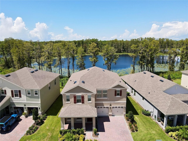 birds eye view of property with a water view