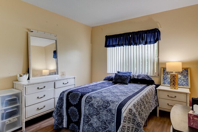 bedroom featuring dark wood-type flooring