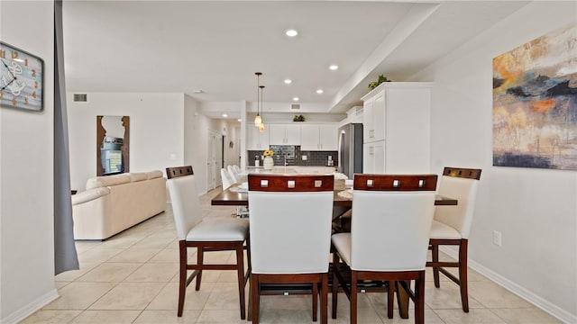 dining area featuring light tile patterned floors