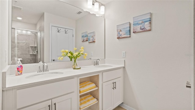 bathroom featuring vanity and an enclosed shower