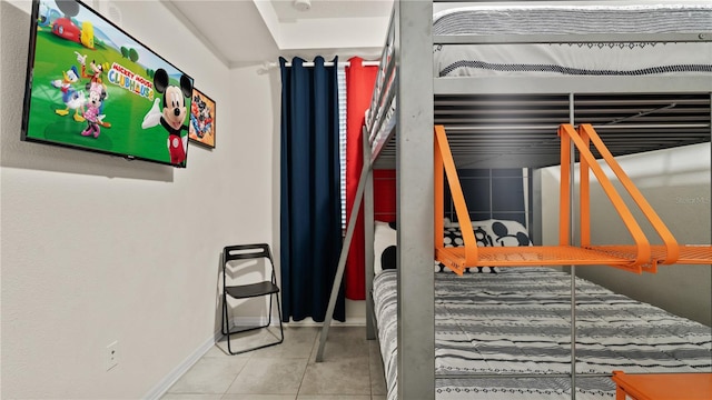 bedroom featuring light tile patterned floors