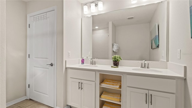 bathroom featuring tile patterned floors and vanity