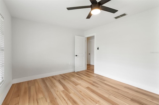 unfurnished room featuring light wood-type flooring and ceiling fan