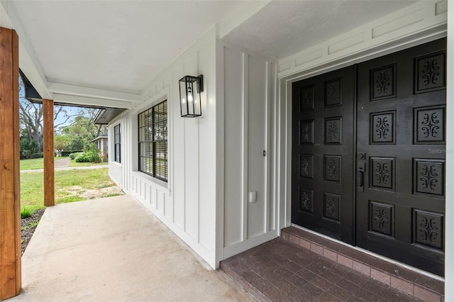 doorway to property with a porch