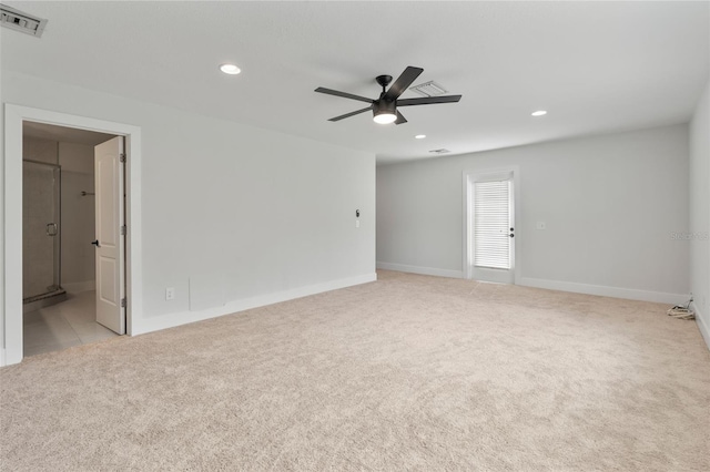 unfurnished room with light carpet and ceiling fan