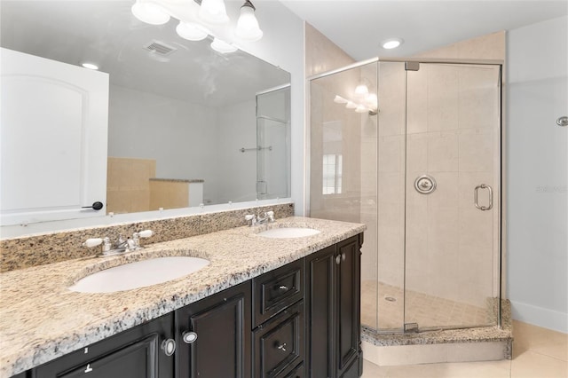 bathroom with vanity, tile patterned floors, and an enclosed shower