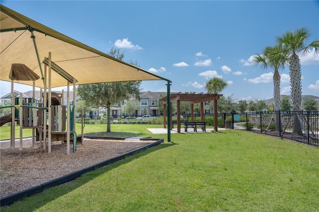 view of jungle gym with a yard and a pergola