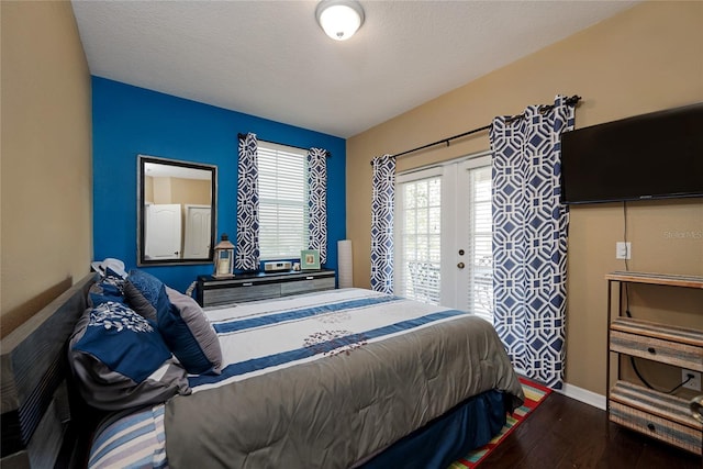 bedroom with wood-type flooring, french doors, and a textured ceiling