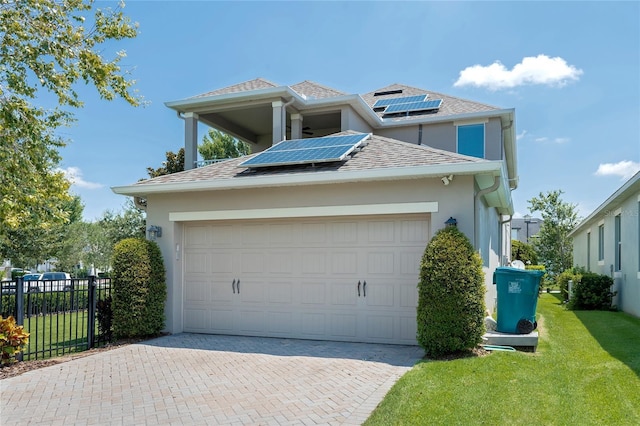 exterior space with a lawn and solar panels