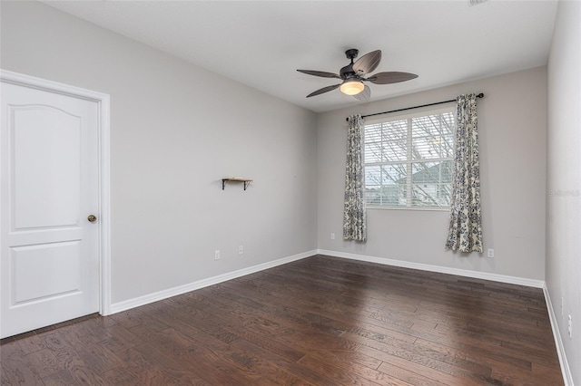 unfurnished room featuring dark hardwood / wood-style floors and ceiling fan