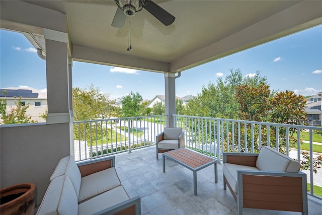 balcony featuring outdoor lounge area and ceiling fan