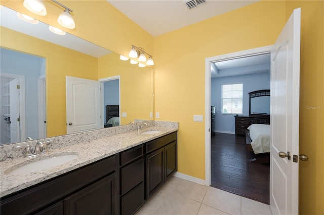 bathroom featuring tile patterned floors and vanity