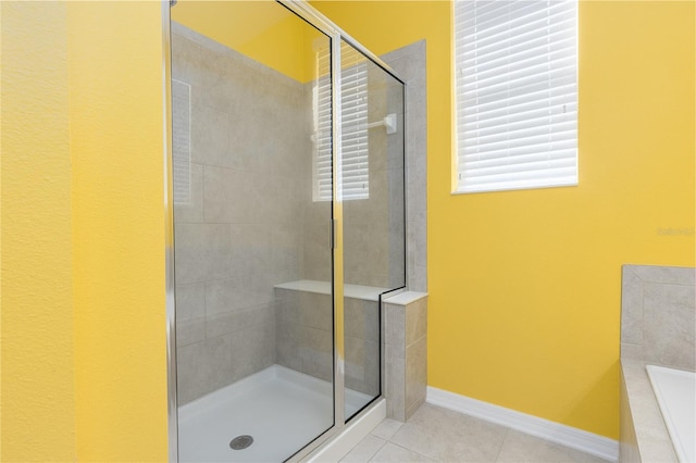 bathroom featuring separate shower and tub and tile patterned floors