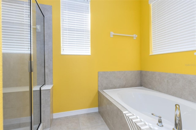 bathroom featuring plus walk in shower and tile patterned flooring