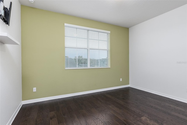 empty room featuring dark hardwood / wood-style floors