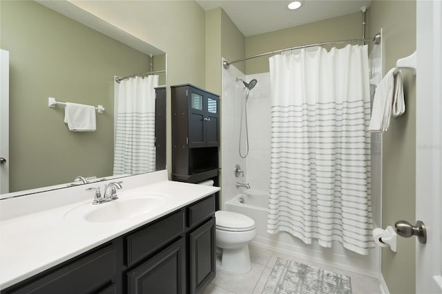 full bathroom featuring vanity, tile patterned floors, toilet, and shower / bath combo