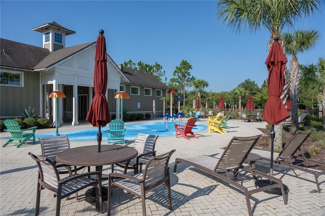 view of swimming pool featuring a patio area