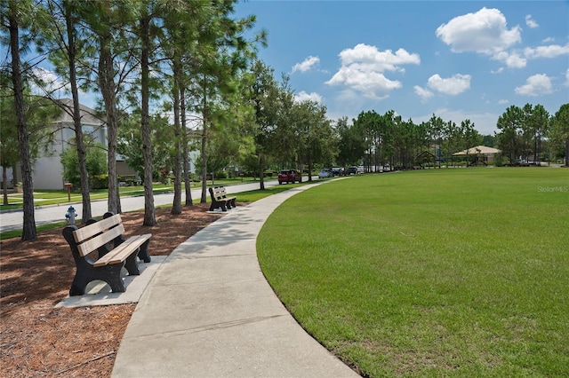 view of property's community with a lawn