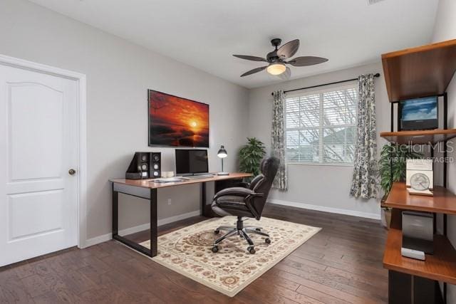 office with dark wood-type flooring and ceiling fan