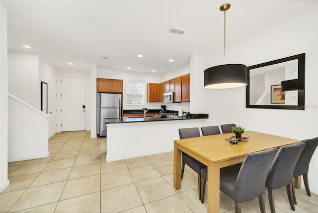 tiled dining area with sink