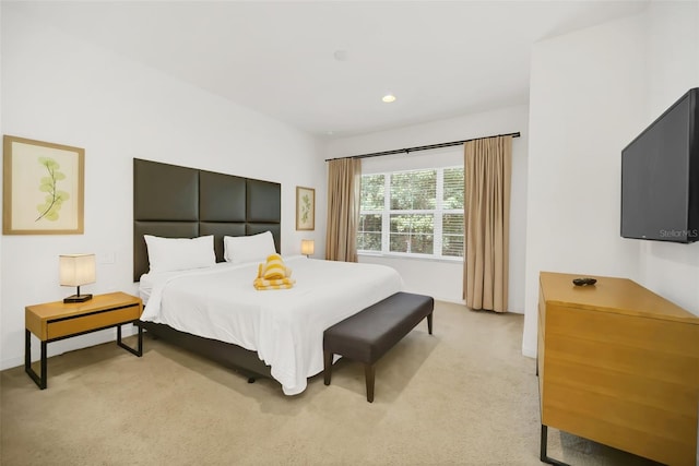 bedroom featuring light colored carpet