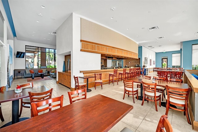 dining room with light tile patterned flooring