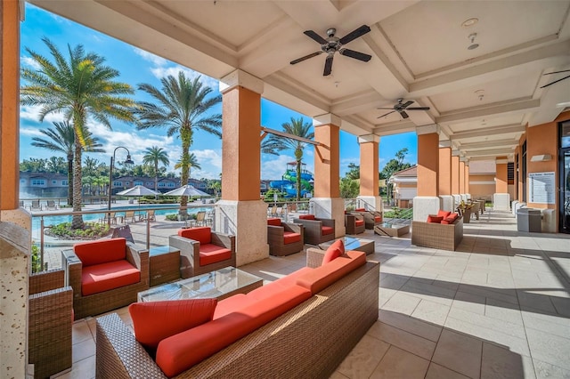 view of patio with a balcony, ceiling fan, and an outdoor hangout area